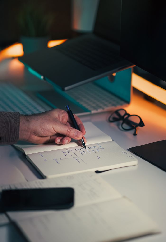 Mastering the First Impression: Your intriguing post title goes here A detailed photo of a workspace focusing on productivity tools like a notebook, pen, and laptop.